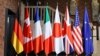 G7 անդամ երկրների դրոշները. Գերմանիա, Կանադա, Ֆրանսիա, Իտալիա, Ճապոնիա, Մեծ Բրիտանիա, ԱՄՆ և ԵՄ