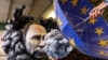 Фигура, изображающая Владимира Путина, угрожающего Европе, на традиционном карнавале в Майнце (Германия), февраль 2023 года 