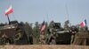 Exercițiul militar Defender Europe 2022 al trupelor franceze, americane și poloneze, pe fondul invaziei rusești a Ucrainei, la poligonul militar din Bemowo Piskie, lângă Orzysz, Polonia, 24 mai 2022.