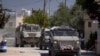 Vehicule blindate ale armatei israeliene intră în orașul palestinian Jenin în timpul unei operațiuni militare în nordul Cisiordaniei ocupate, pe 21 mai 2025.