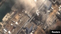 Japan - The No.3 nuclear reactor of the Fukushima Daiichi nuclear plant at Minamisoma is seen burning after a blast following an earthquake and tsunami in this handout satellite image taken 14Mar2011