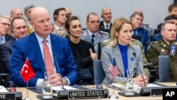 US Ambassador to NATO Matthew Whitaker (left) and European Union foreign policy chief Kaja Kallas attend a meeting of the Ukraine Defense Contact Group in Brussels on April 11.