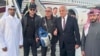 US citizen George Glezmann (center) poses with Adam Boehler (second left) and Zalmay Khalilzad (second right) and Qatari diplomats in Kabul, Afghanistan, March 20, 2025, before departing to Doha, Qatar.