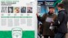 Мужчины беседуют у предвыборного баннера партии "Укроп". Киев, 23 октября 2015 года. 