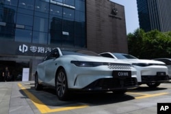 Chinese EVs on display outside a showroom in Zhejiang Province. (file photo)