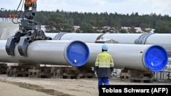 GERMANY -- A man works at the construction site of the Nord Stream 2 gas pipeline in Lubmin, March 26, 2019