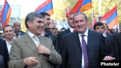 Armenia - Opposition leaders Levon Ter-Petrosian (R) and Aram Sarkisian lead a demonstration in Yerevan.