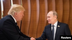 Президент США Дональд Трамп і президент Росії Володимир Путін. Cаміт G20. Німеччина, Гамбург, 7 липня 2017 року.