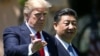 U.S. -- U.S. President Donald Trump and Chinese President Xi Jinping chat as they walk along the front patio of the Mar-a-Lago estate after a bilateral meeting in Palm Beach, Florida, April 7, 2017