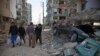 Residents look at the damage following a 7.3-magnitude earthquake in Sarpol-e Zahab in Iran's western province of Kermanshah on November 13
