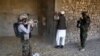 Afghan soldiers conduct a security check during operations in Achin district of the eastern Nangarhar province in January