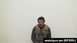 Azerbaijan - A screenshot of video of an Armenian man paraded on Azerbaijani television.