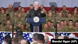 U.S. Vice President Mike Pence speaks to troops in a hangar at Bagram Air Field on December 21.