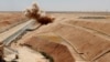 Syria -- Members of Kurdish Rojava Mine Control Organization destroy explosive devices planted by Islamic State militants near Ain Issa village north of Raqqa, June 20, 2017