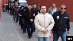 Earlier this year in Turkey, suspected supporters of the U.S.-based cleric Fethullah Gulen were escorted by plainclothed police officers.