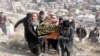 People attend the funeral of one of the victims of a suicide bomb attack in Kabul on January 28. 