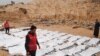 The bodies of 74 migrants who drowned in the Mediterranean trying to reach Europe after they washed up on a beach near Zawiyah on Libya’s northern coast, in February 2017.