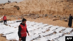 The bodies of 74 migrants who drowned in the Mediterranean trying to reach Europe after they washed up on a beach near Zawiyah on Libya’s northern coast, in February 2017.