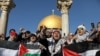 Worshippers chant as they hold Palestinian flags after Friday prayers in Jerusalem's Old City December 8.