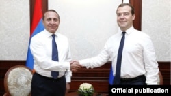 Russia/Armenia - Russian Prime Minister Dmitry Medvedev (R) welcomes his visiting Armenian counterpart Hovik Abrahamian in Sochi,11Jul2014