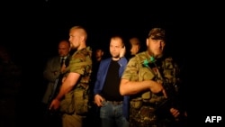 (Так званий «прем’єр-міністр» угруповання «ДНР», громадянин Росії Олександра Борода)