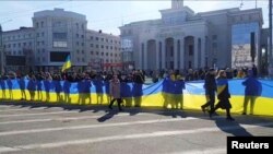 Під час акції в центрі Херсона проти російської окупації, 13 березня 2022 року