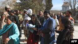 Security personnel evacuate a Methodist church after a suicide bomber attack in Quetta in December 2017.