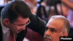 Armenia -- Armen Martirosian of the Zharangutyun Party (L) talks to its top leader, Raffi Hovannisian, during a party congress, 10Jul2010.