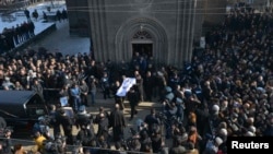 Armenia -- People carry the coffin with the body of six-month-old boy Seryozha Avetisian after he died of his wounds in hospital, following a killing spree last week, during a funeral ceremony in Gyumri, January 21, 2015