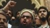 The U.S. administration is concerned that Islamist leader Hafiz Saeed (C) and the radical groups he leads remain free and untouched in Pakistan. (file photo)