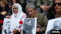 Turkey -- Turks hold up pictures of Armenian intellectuals rounded up and executed in 1915 during a public commemoration in Istanbul, 24Apr2010