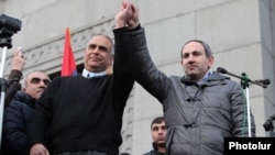 Armenia - Opposition leaders Raffi Hovannisian (L) and Nikol Pashinian greet protesters in Yerevan's Liberty Square, 20Feb2013.