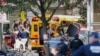 Authorities inspect a damaged school bus after the terrorist attack in New York on October 31.
