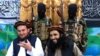 Tehreek-e-Taliban Pakistan (TTP) spokesman Ehsanullah Ehsan, left, and with TTP member Adnan Rasheed in 2013