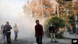 Iranian university students attend a protest inside Tehran University.