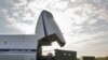 Идет погрузка спецтехники и грузов в транспортный самолет АН-124-100. Московская область, 2 октября 2006 года. 