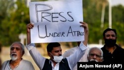 Pakistani journalists and members of civil society protesting against attacks on journalists in Islamabad.