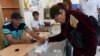 Armenia - A voter in Tsaghkahovit village casts a ballot in a local election, 18Sep2016.