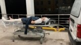 Blogger Miraziz Bazarov arrives at a hospital after he was beaten by a group of unidentified men in Tashkent on March 29.
