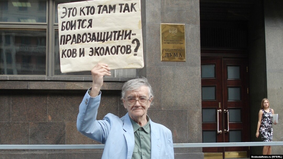 A supporter of the opposition Yabloko party protests against the NGO bill in front of the State Duma in Moscow on July 6. His sign reads, "Who is it in there who's so afraid of rights activists and ecologists?"