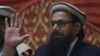 The Pakistani head of Jamaat-ud-Dawa (JuD), Hafiz Saeed, speaks at a press conference in Lahore on January 23.