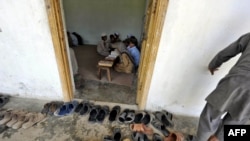 Students recite Koranic verses at an Islamic madrasah on May 10, near Abbottabad, Pakistan, where Osama bin Laden was killed on May 1-2.
